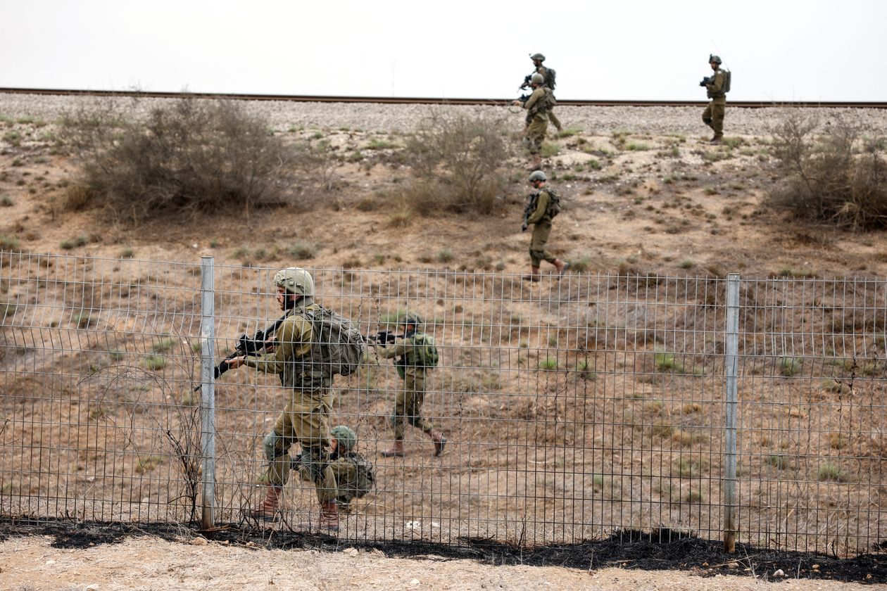 Israeli troop reinforcements took position at the border with Gaza on Monday. PHOTO: JACK GUEZ/AGENCE FRANCE-PRESSE/GETTY IMAGES